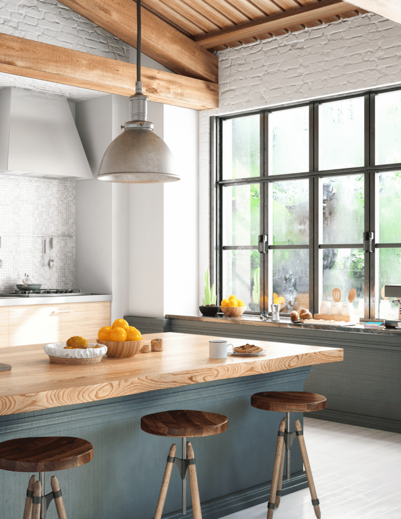 Modern kitchen with white cabinets, island, and stainless steel appliances in Kitchener Waterloo home