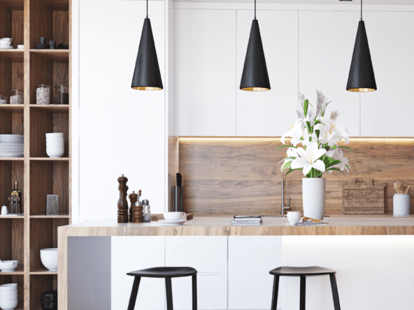 Modern kitchen with white cabinets, island, and stainless steel appliances in Kitchener Waterloo home